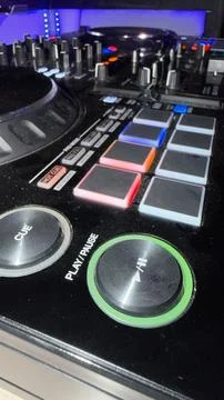 Close up view of a professional DJ controller mixing deck with glowing 库存照片