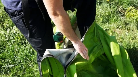 Close up view of a professional ecologist, scientist putting on protective Stock Footage 99361287