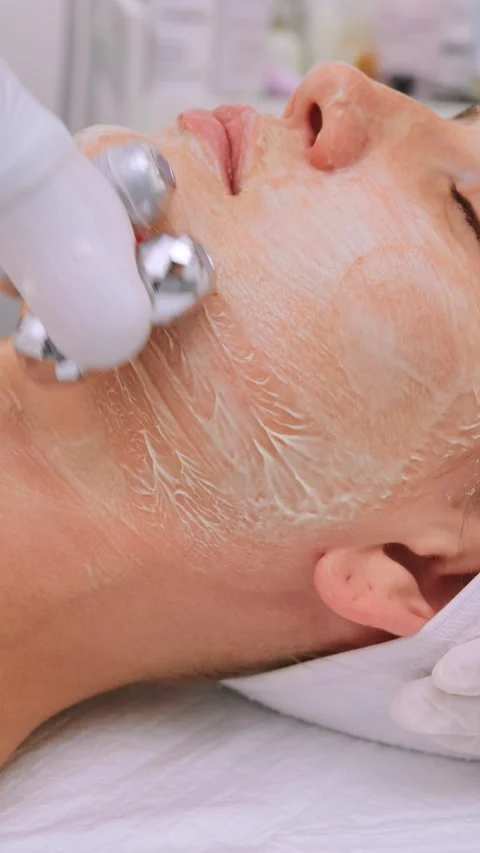 Close-up view of a professional esthetician performing a rejuvenating facial Stock-Footage 337706959