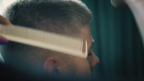 Close up view on professional haircut process in barber shop. Female hairdresser Stock Footage 93745935