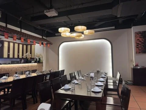 Close-up view of a professionally arranged dining table in a high-end Stock Photos