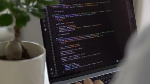 Close view of programming interface with developer hands working on keyboard Видео 345654142