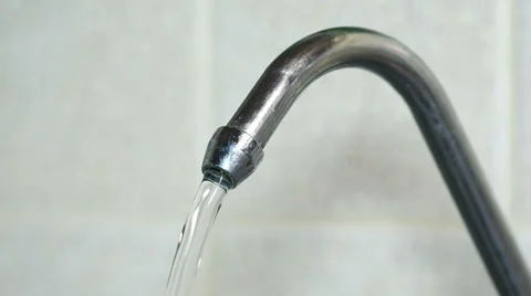 Close-up View of Puring Water from a Kitchen Faucet. 4K Stock Footage 45968579