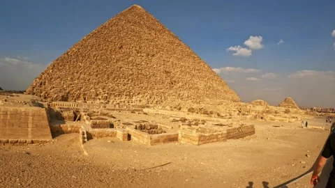 Close up view of pyramid of giza in egypt walking beside the masssive stone Stock Footage 219280854