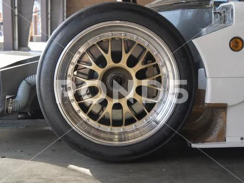 Close Up View of Race Car Wheel and Tire Stock Photos