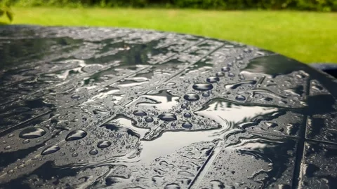 Close-up view of rain on garden table Stock Footage 209150450