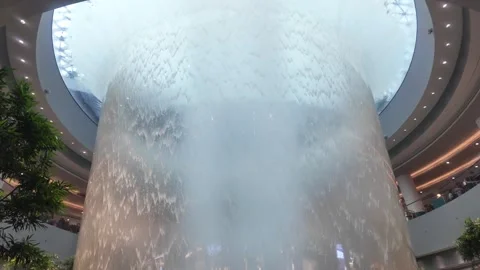Close-Up View of Rain Vortex Waterfall at Jewel Changi Airport Singapore 4K Stock Footage 339951962
