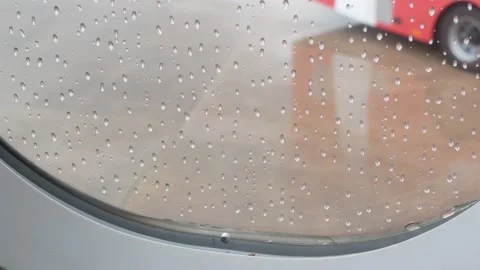 Close up view to raindrop droplet on surface of the airplane window while l.. Stock Footage 296088668