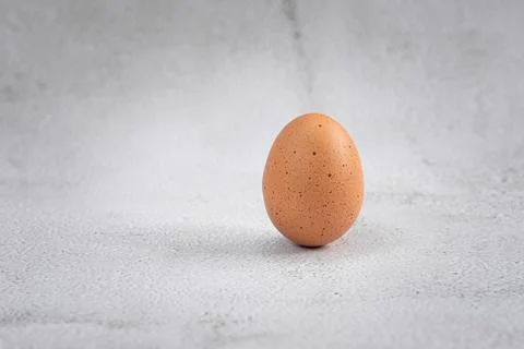 Close-up view of raw chicken eggs on white background. Eggs are often said to Stock Photos