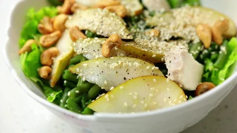 Close up view of ready prepared fresh salad add oil in white plate delicious Video stock 112620573