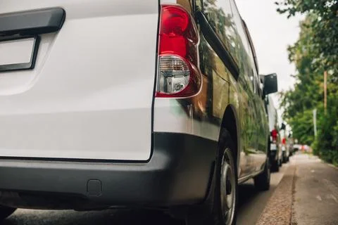 Close up view of the rear end of cargo van parked at the roadside Stock Photos