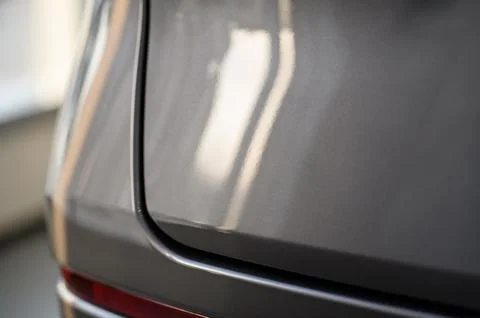 Close up view of the rear part of the modern grey car Stock Photos