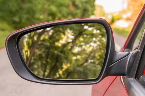 Close-up view of rearview mirror on the red car Stock Photos