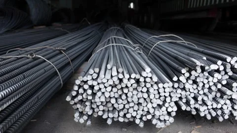 Close view of rebar rods stacked on concrete shows metal alignment and supply at Stock Footage 312781507
