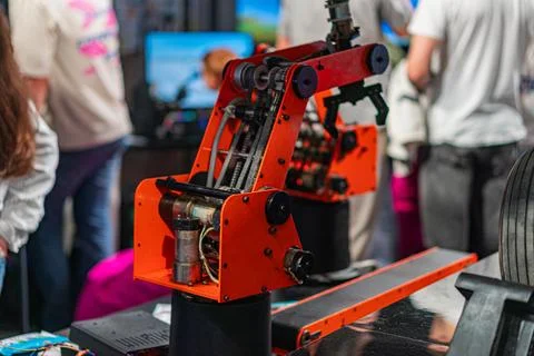 A close-up view of a red and black robotic arm with multiple joints, displa.. Stock Photos