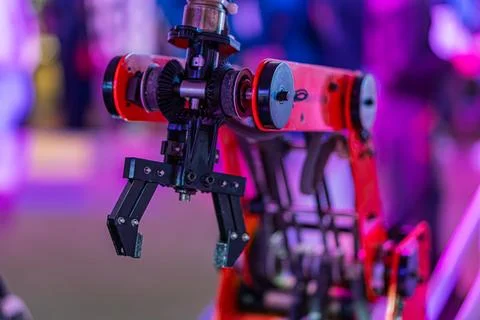 A close-up view of a red and black robotic arm with multiple joints, displa.. Stock Photos