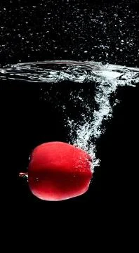 Close view red apple falling Stock Photos