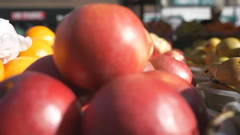 A close up view of red apples in plates at a street market. Stock Footage 304844070