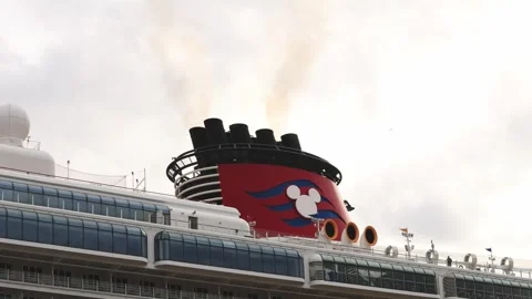 Close view of the red Disney Cruise Line funnel and Mickey Mouse emblem Stock Footage 341036286