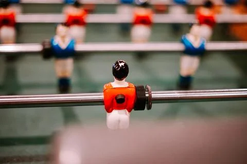 Up close view of a red foosball player on table Stock Photos