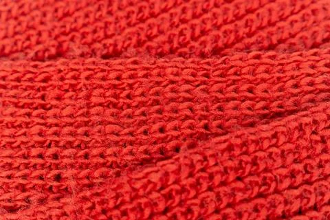 Close-up view of red knitted fabric showing texture and pattern details Stock Photos