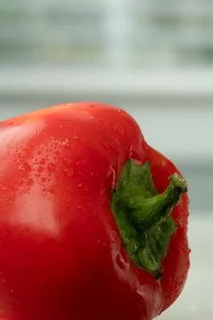 Close view of red pepper in front of kitchen window Stock Photos