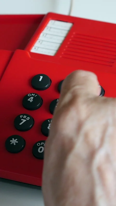 Close View Of Red Phone With Hand Dialing Number. Vertical. Stock Footage 296685506