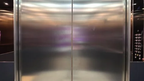 Close View of Reflective Elevator Doors and Metal Panels in a Gothenburg Hotel Stock Footage 347680187