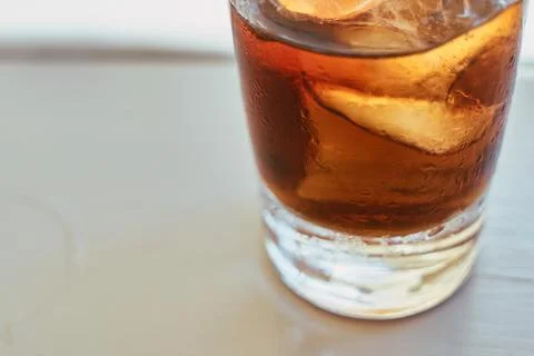 Close-up view of a refreshing glass of cola beverage with ice cubes Stock Photos
