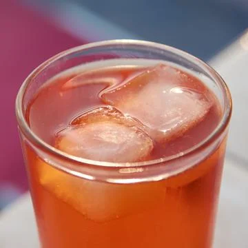 Close-up view of a refreshing orange spritz cocktail with melting ice cubes Stock Photos