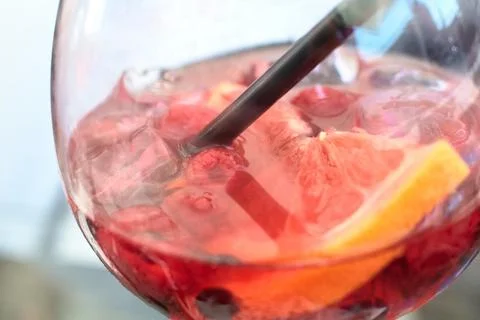 Close-up view of a refreshing pink gin cocktail with fresh fruits and ice Stock Photos