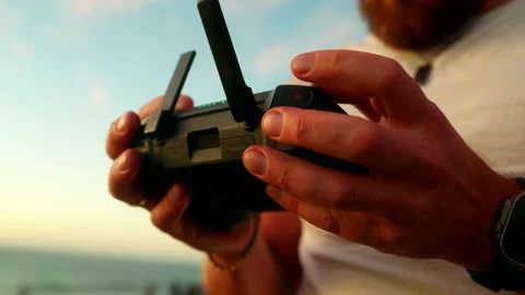 Close-up view, Remote Flying, Drone Operation, Controller Device Stock Footage 334610382