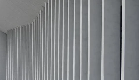 Close view of repeating vertical pillars creates abstract pattern on building 스톡 사진
