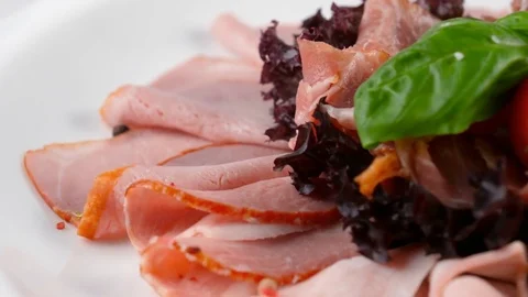 Close-up view of Restaurant Antipasto, sliced meat, ham and jamon on top Stock Footage 84262701