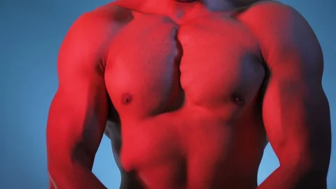 Close view of ripped bodybuilder standing strong and showing muscles indoor Stock Footage 118301454