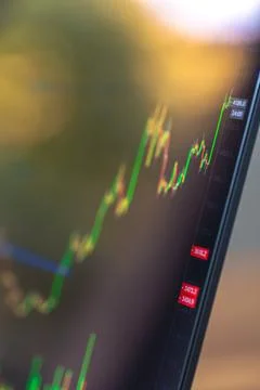 Close view of rising trading chart on screen. Financial market data and inv.. Stock-Fotos