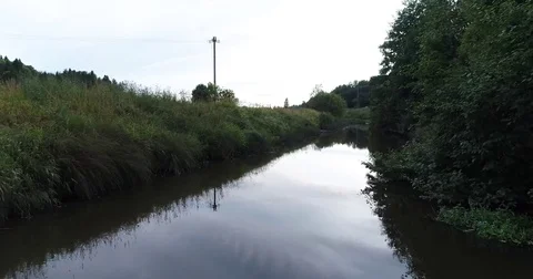 Close up view of river during summer day. Drone filming forward and rising up Stock Footage 79340758