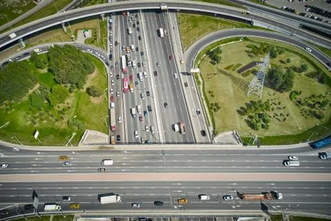 Close up view on road cross between highway and round exits. Top down view. Stock Photos