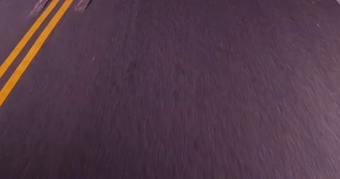 Close up view of road from moving car Stock Footage 136341107