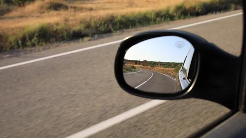 Close up view of road reflection in car side view mirror. Video stock 138251149