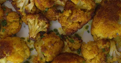 Close-up view of roasted cauliflower with turmeric. Stock Footage 310624405