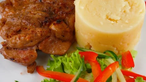 Close-up view of Roasted Chicken Breast with mashed potatoes and vegetables Stock Footage 79712173