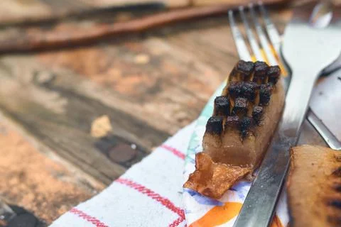 Close-up view of roasted pork fat and bacon served on a wooden table Stock Photos