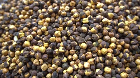 Close Up View of Roasted Split Brown Chickpeas Piled up at a Market Video stock 340480435