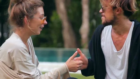 Close view of romantic young couple is spending time with each other playing Video stock 85526865