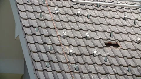 Close Up View, Roof with Solar Panel Mounting Rails, Slow Tilt Down Stock Footage 150195913