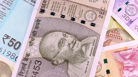 Close up view of rotating 10, 20, 50, 200, 500 Indian rupees, brand new notes. Stock Footage 296428728
