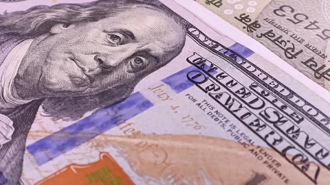 Close up view of rotating 500 Indian rupees and 100 USD american dollars. Stock Footage 296428204