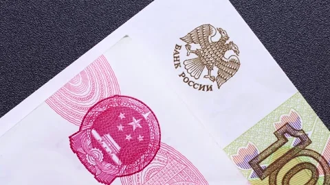 Close up view of rotating Chinese Yuan and Russian ruble banknotes. Stock Footage 309892895