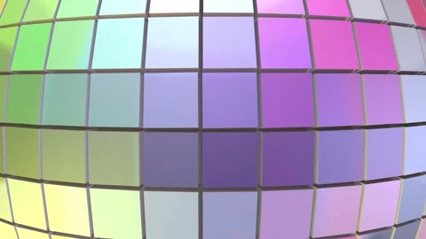 Close view of a rotating disco ball with mirrored square tiles and pastel Stock Footage 348162352